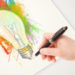 Hand drawing colorful idea light bulb with a pen